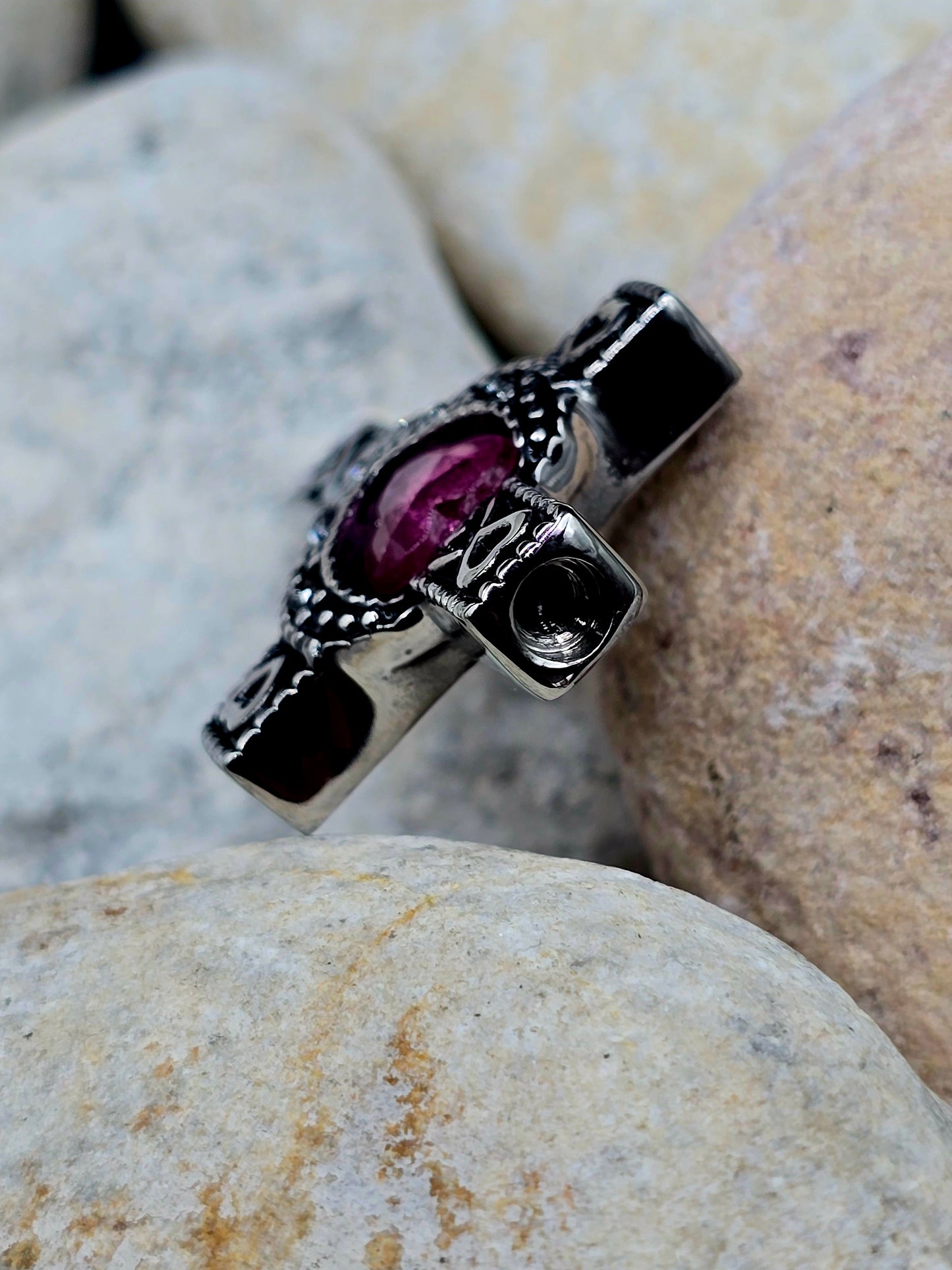 Stainless steel cross with purple stone