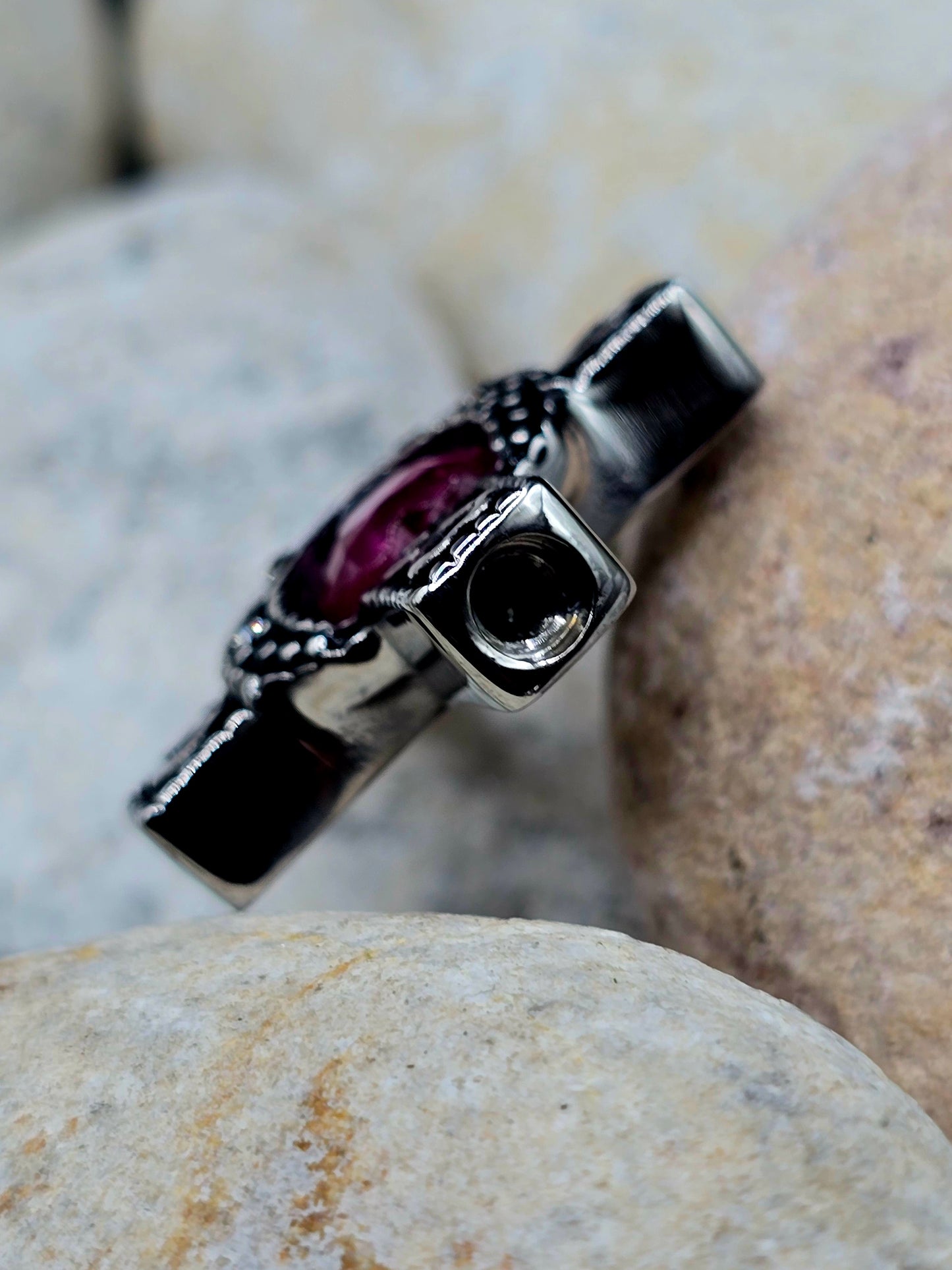 Stainless steel cross with purple stone