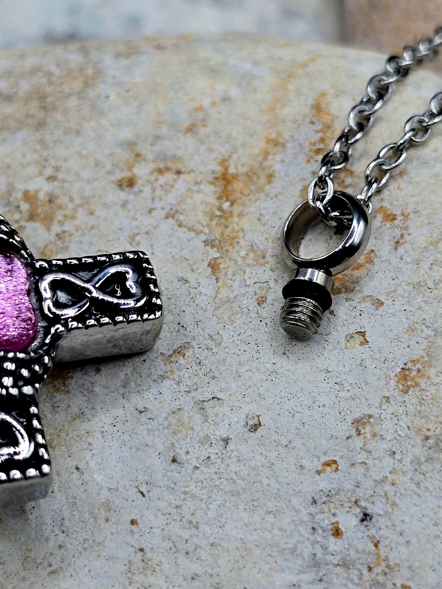 Stainless steel cross with purple stone