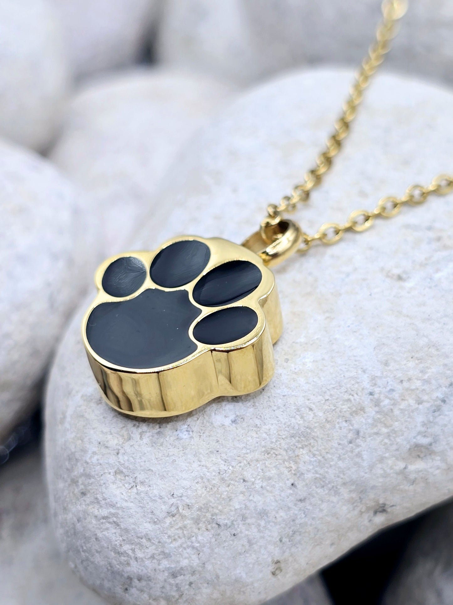 Gold and black paw urn necklace