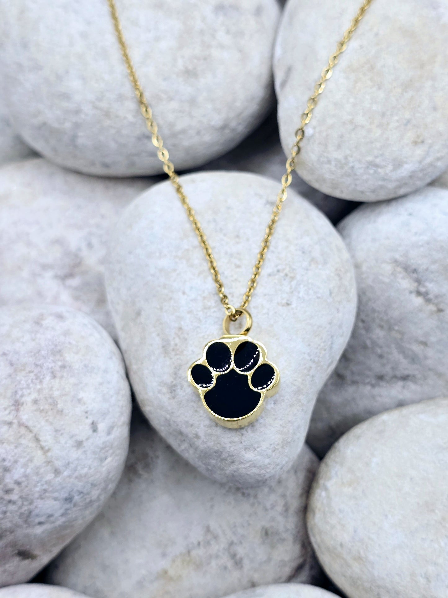 Gold and black paw urn necklace