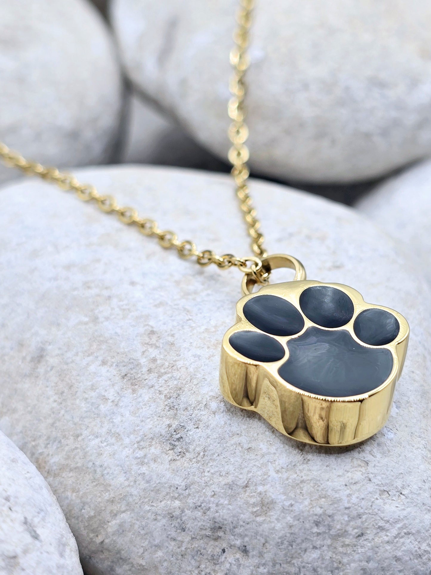 Gold and black paw urn necklace