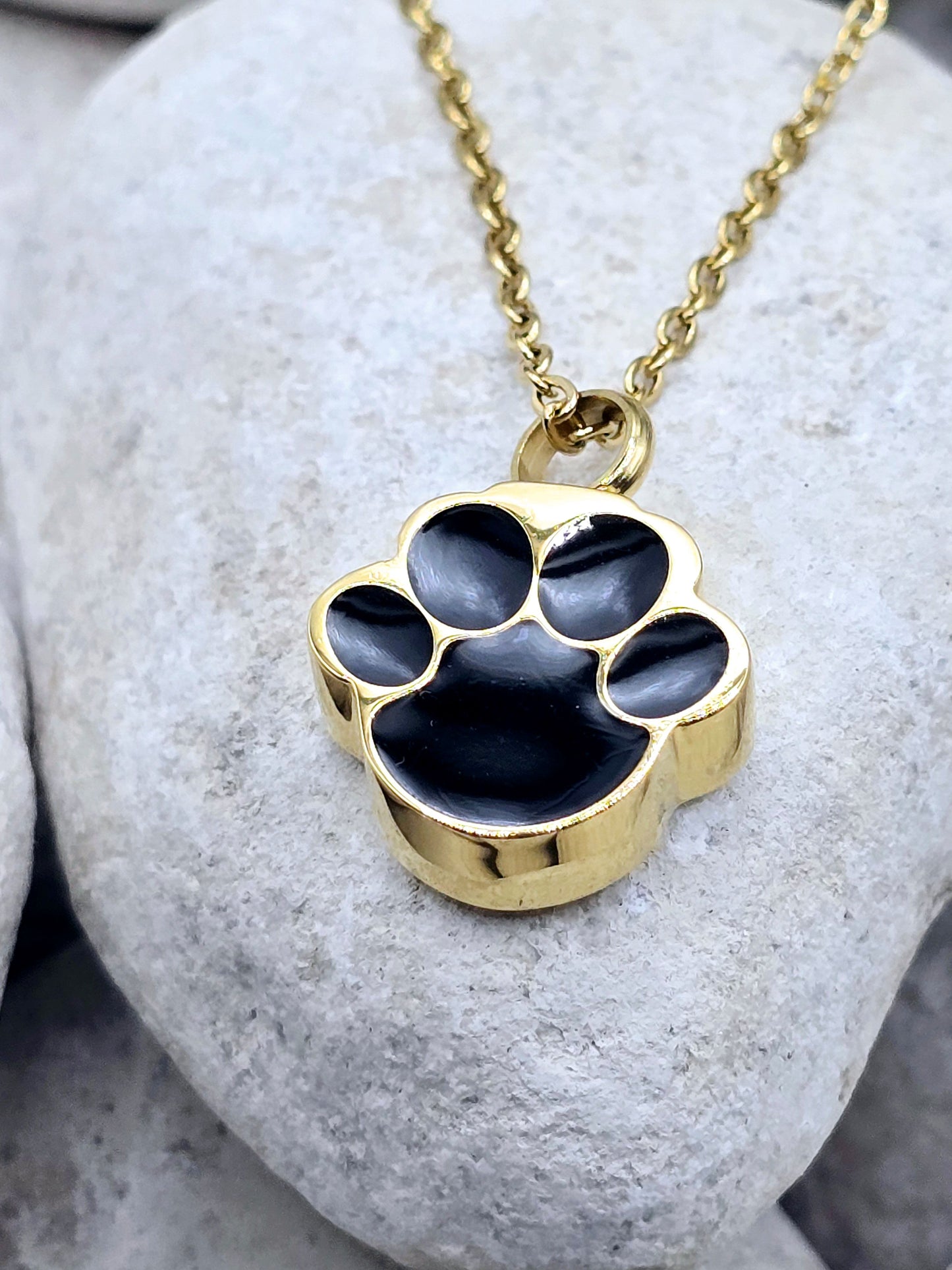 Gold and black paw urn necklace